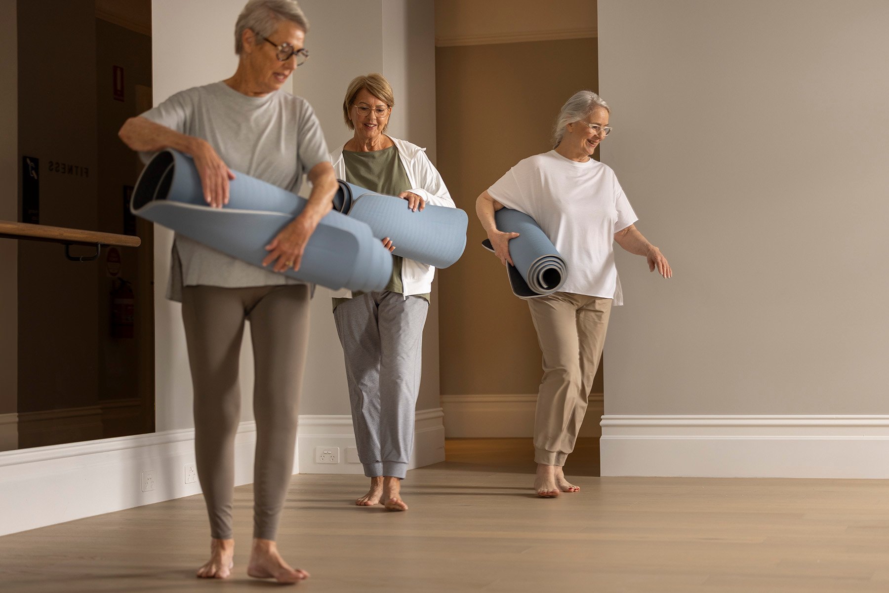 StFrancis women walking into wellness studio