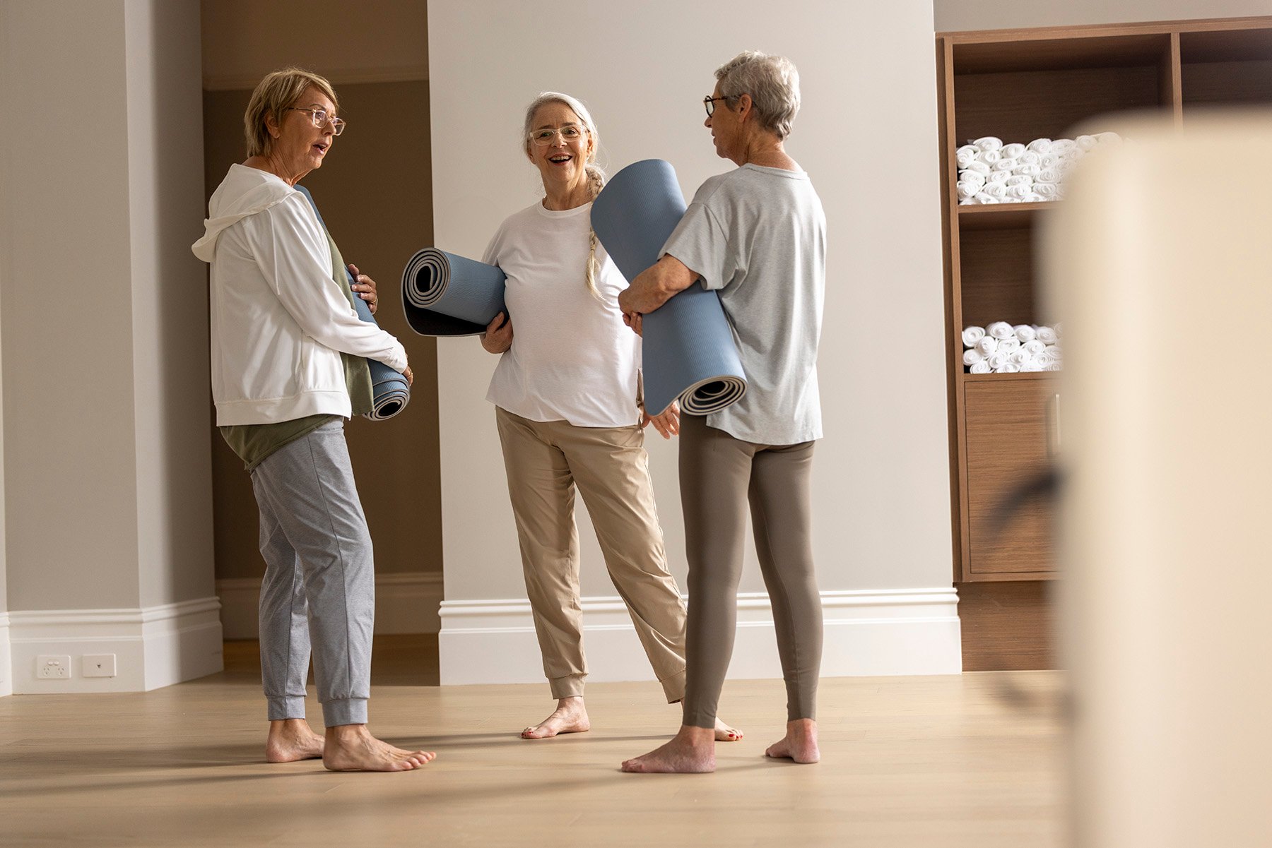 StFrancis women with yoga mats